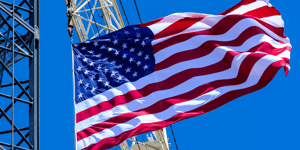 United States flag flying on a tower crane